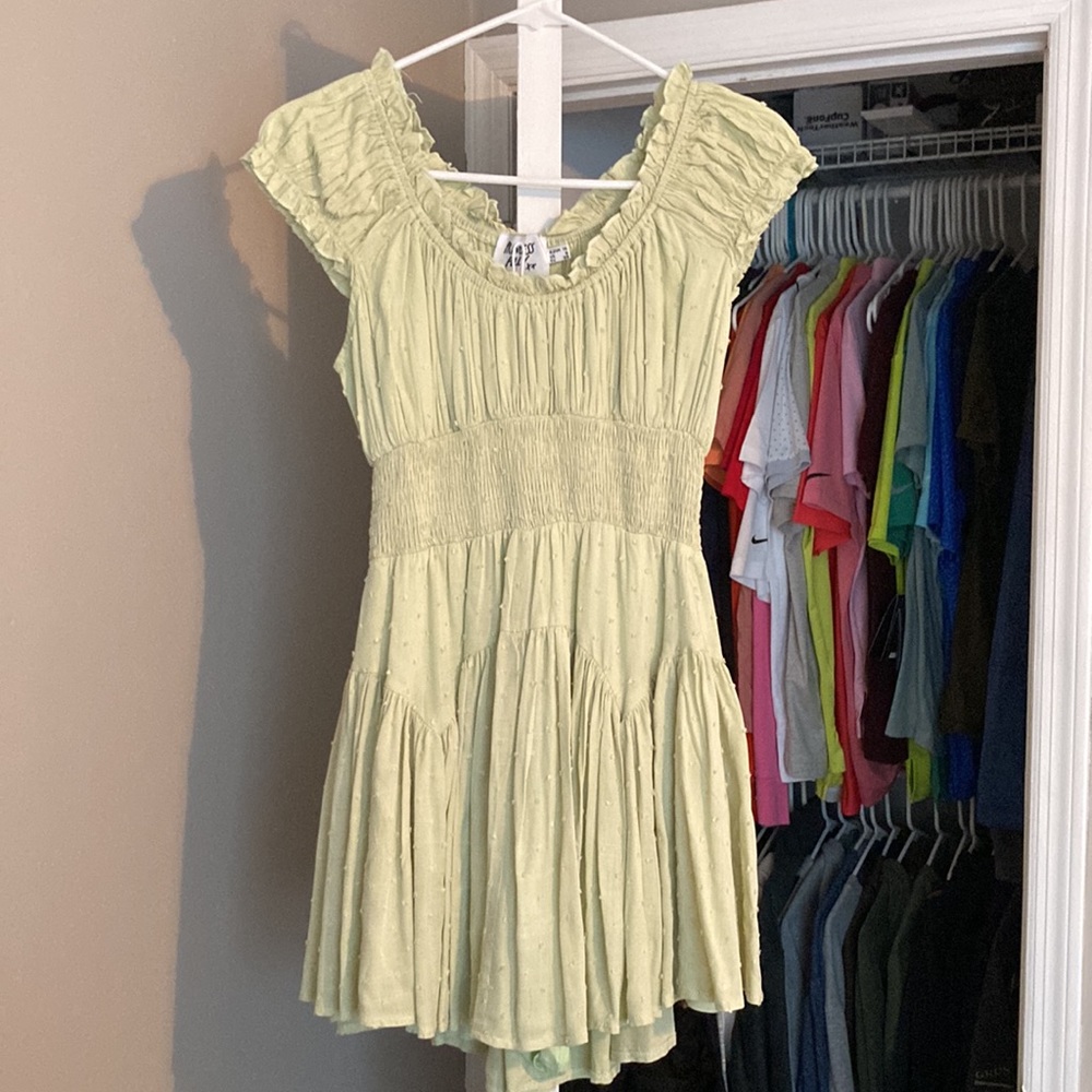 Light green (lime) princess Polly dress with dotted detailing throughout.